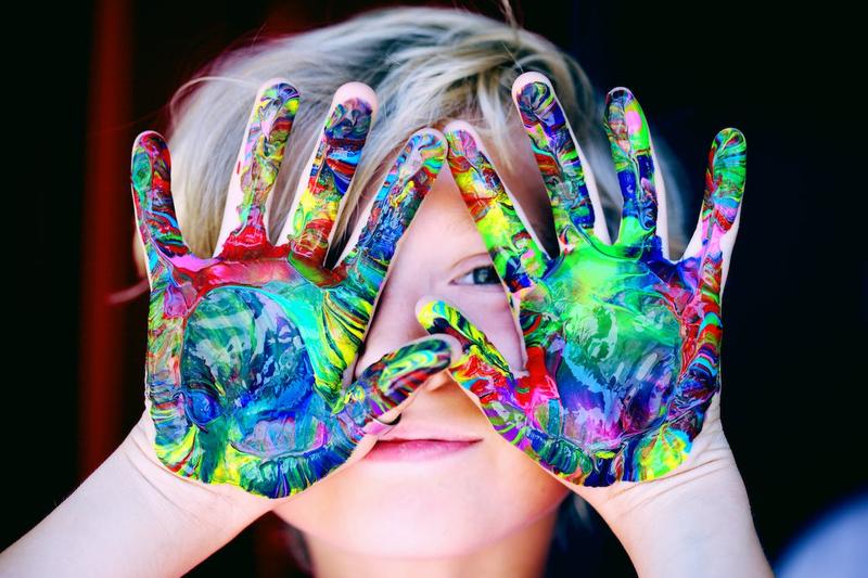 Kid with finger paint